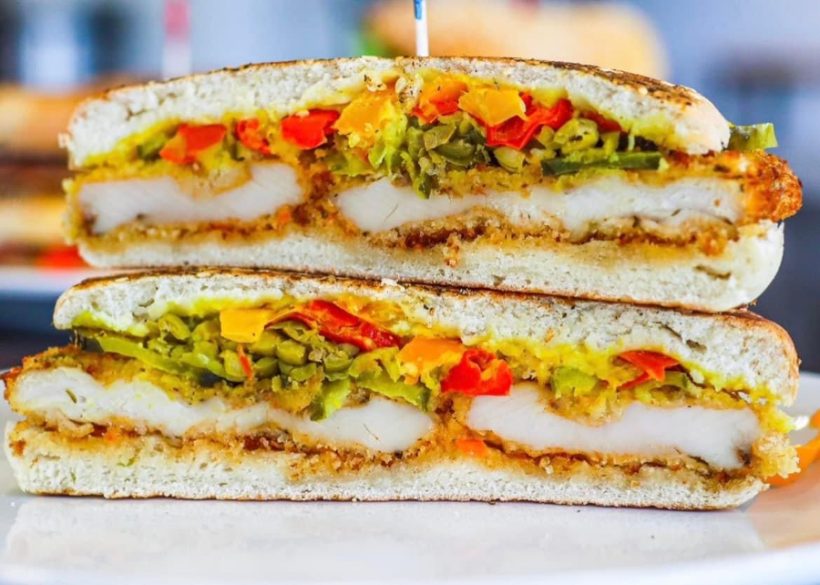 The Schnitzel Panini — panko-crusted chicken, hummus & peppers, pressed