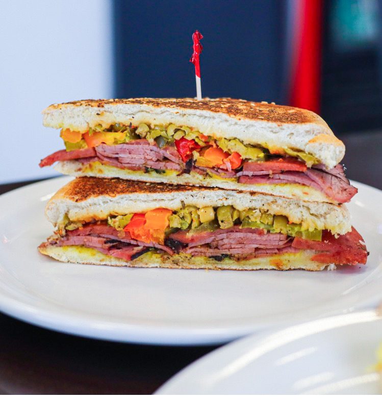 The Cracker — pressed Montreal smoked meat & salami sandwich